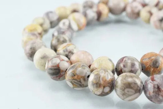 Multicolored jasper gemstone beads on a string.