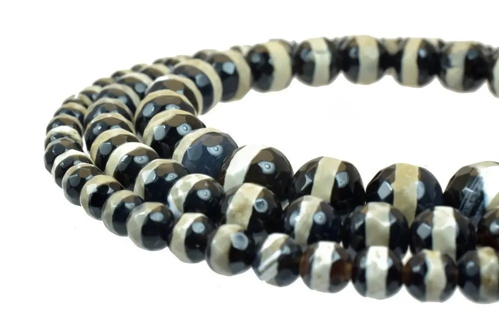 Faceted black and cream striped gemstone bead necklace.