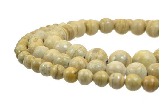 Natural beige stone bead necklace close-up.