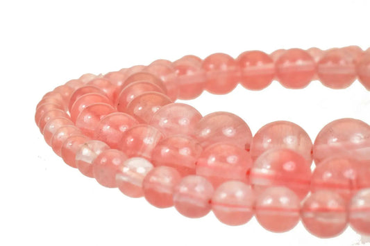 Pink rose quartz beaded necklace close-up.