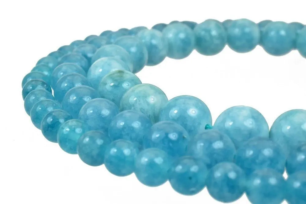 Blue jade beads necklace on white background