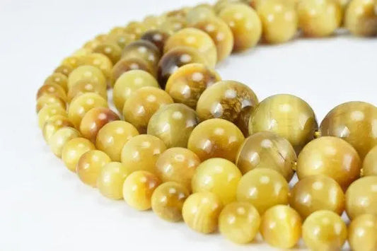 Golden yellow tiger eye gemstone beads necklace close-up.