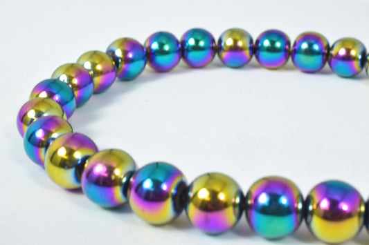 Colorful metallic bead necklace on white background.