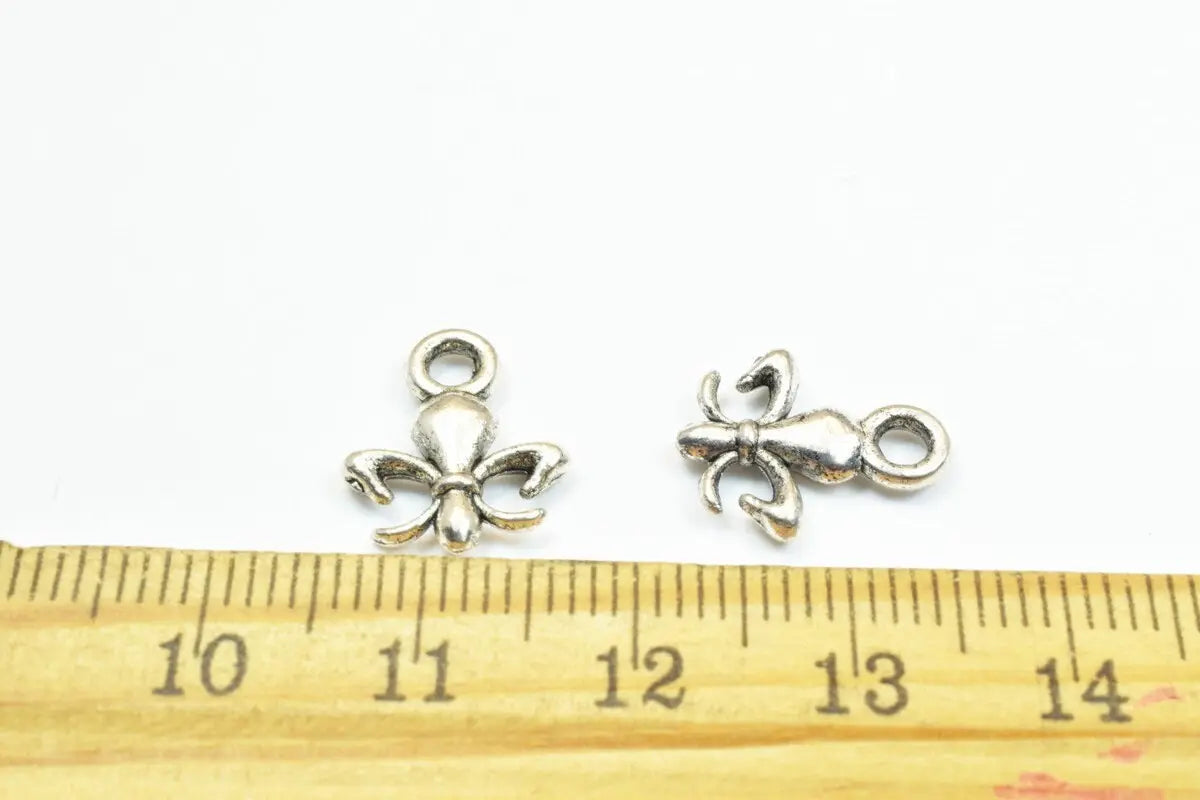 22 PCs Silver Alloy Pendant Charm Fleur De Lis Football Saints Size 14x11.5mm Jump Ring 2mm, 2.5mm Thickness For Jewelry Making - BeadsFindingDepot