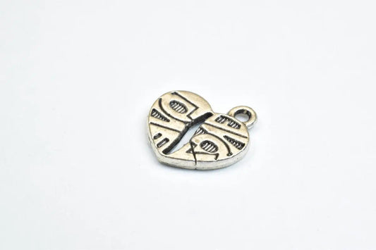 "Silver heart pendant with tribal design"