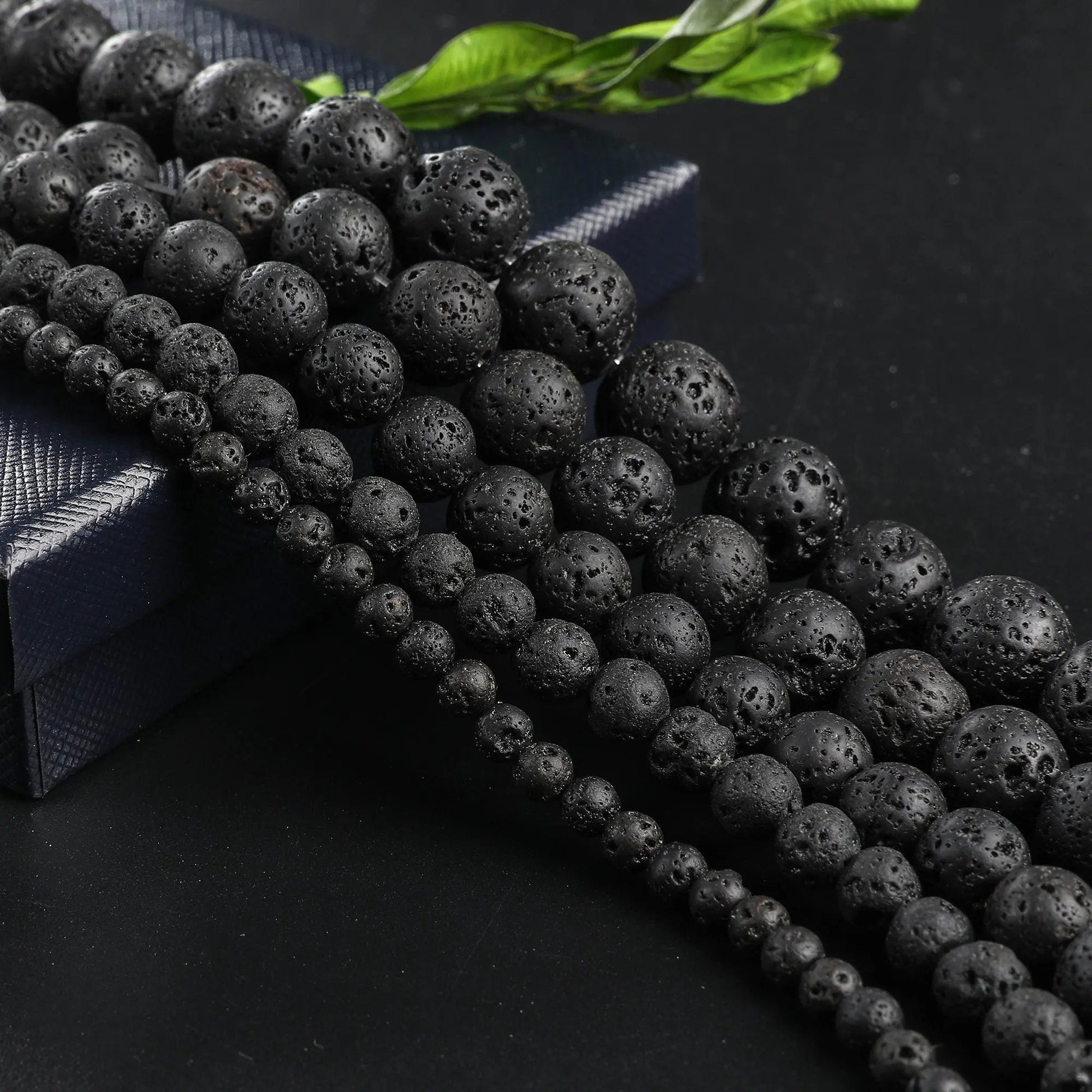 "Black lava stone beads on display"