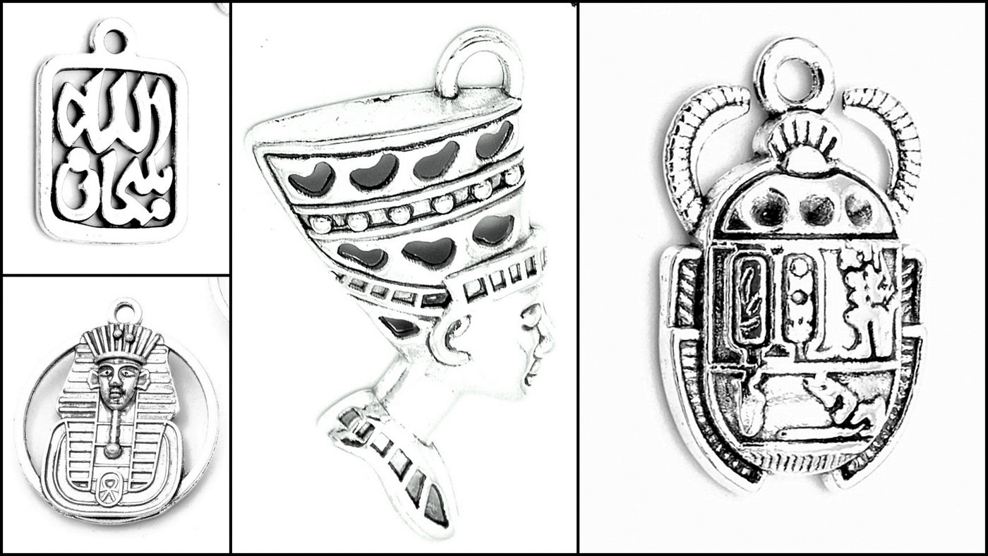 Silver Egyptian-themed charms collection featuring hieroglyphics and pharaoh designs.