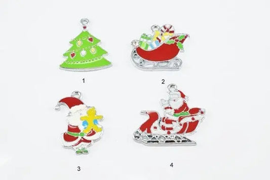 Four Christmas-themed metal charms: green Christmas tree, red sleigh with gifts, Santa with a gift, Santa in sleigh.