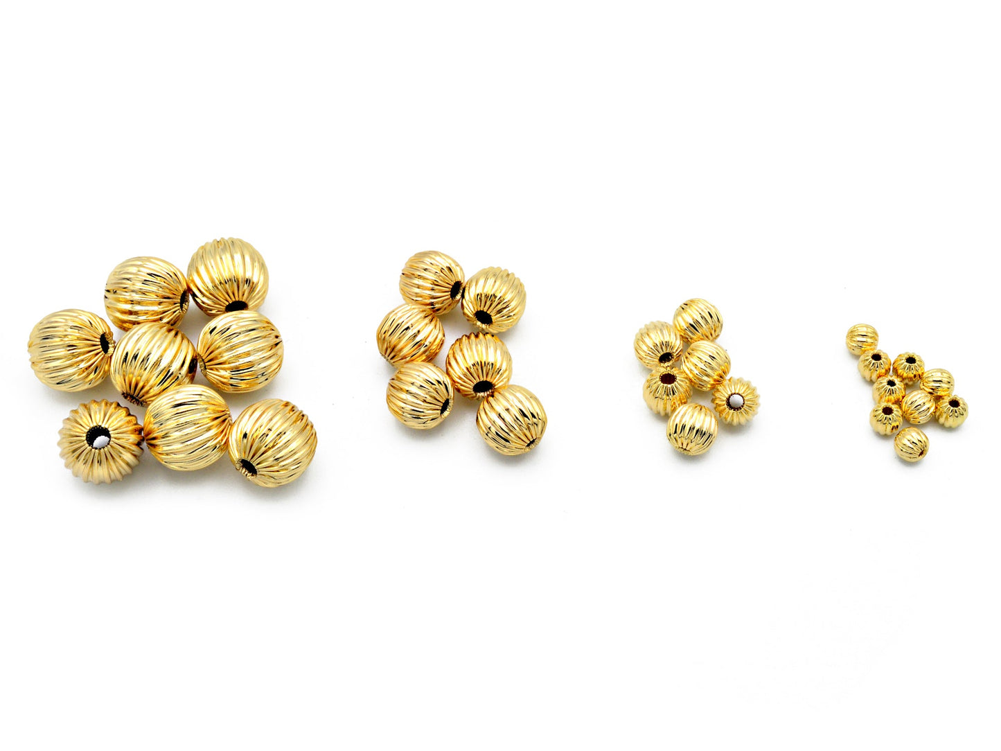 "Set of textured gold spacer beads in various sizes for jewelry crafting"