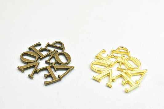 Antique brass and gold tone LOVE letter charms for jewelry making.