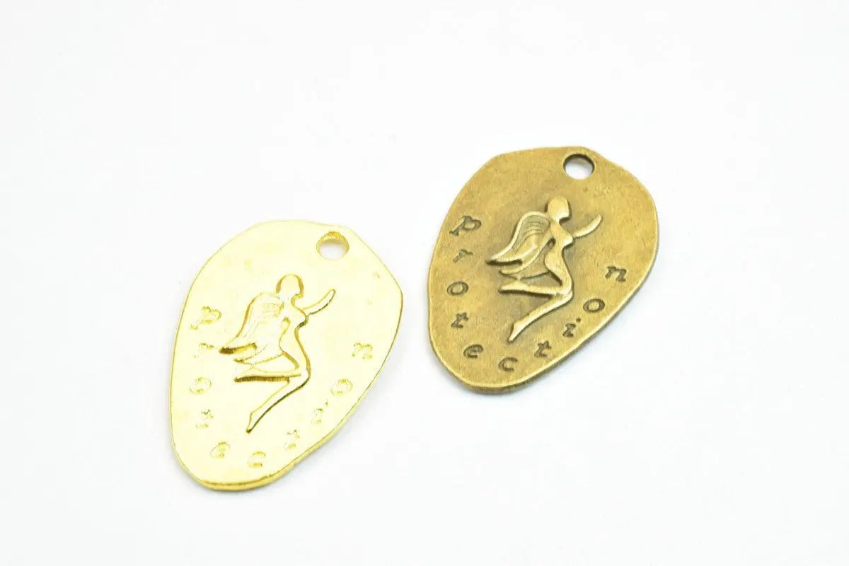 Gold and bronze protection jewelry tags with engraved angel design.