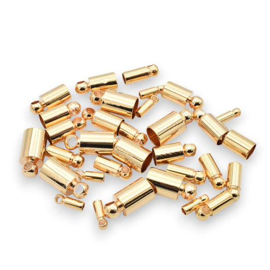 Gold magnetic jewelry clasps on white background.