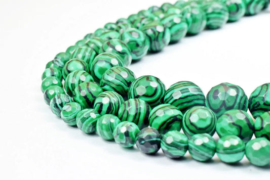 Green malachite gemstone beads string with striped pattern.