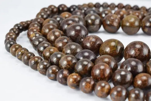 Brown jasper gemstone beads necklace on white background.