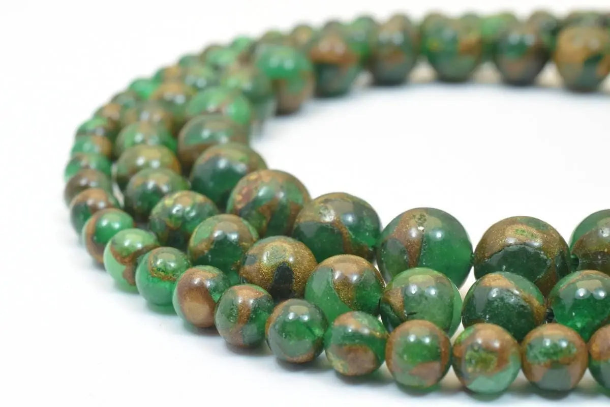 Green and brown marble stone beads necklace close-up.