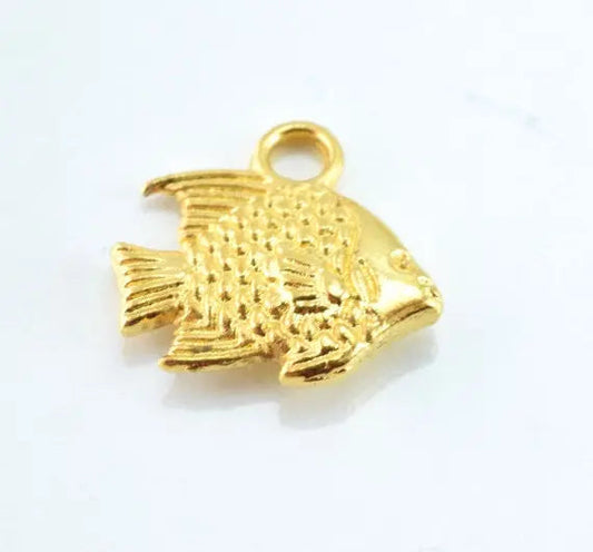 Gold fish-shaped metal charm pendant for jewelry making.