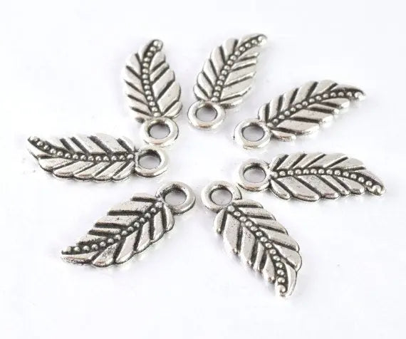 18x7mm Antique Silver Tribal Leaf Charm Pendant with black accent design detail 20pcs/PK 2mm hole opening 2mm thickness - BeadsFindingDepot