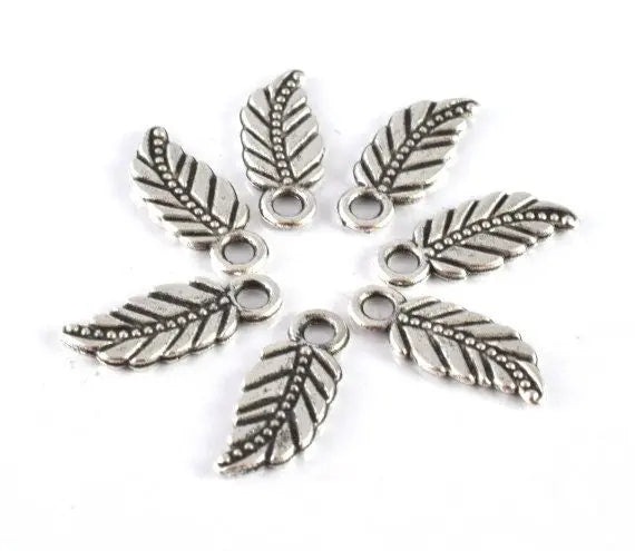 18x7mm Antique Silver Tribal Leaf Charm Pendant with black accent design detail 20pcs/PK 2mm hole opening 2mm thickness - BeadsFindingDepot
