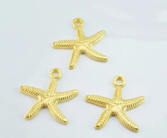 Gold starfish charms for jewelry making.