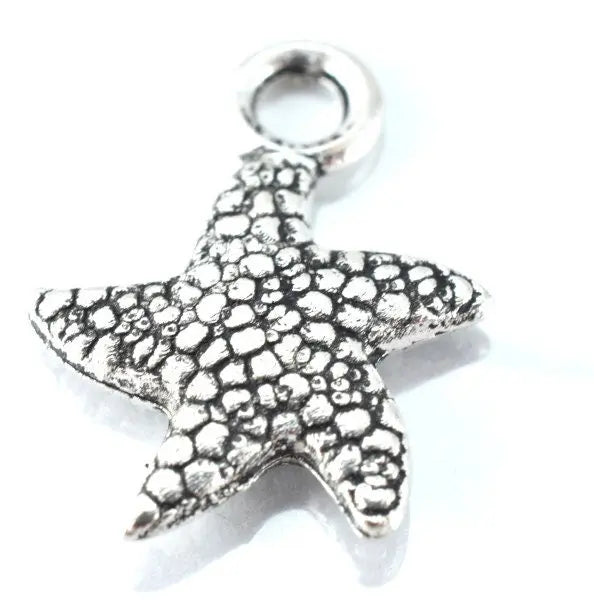 Textured silver starfish charm pendant.