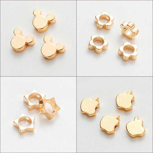 Gold-plated charm beads in assorted shapes including Mickey, flower, star, and apple for jewelry making.