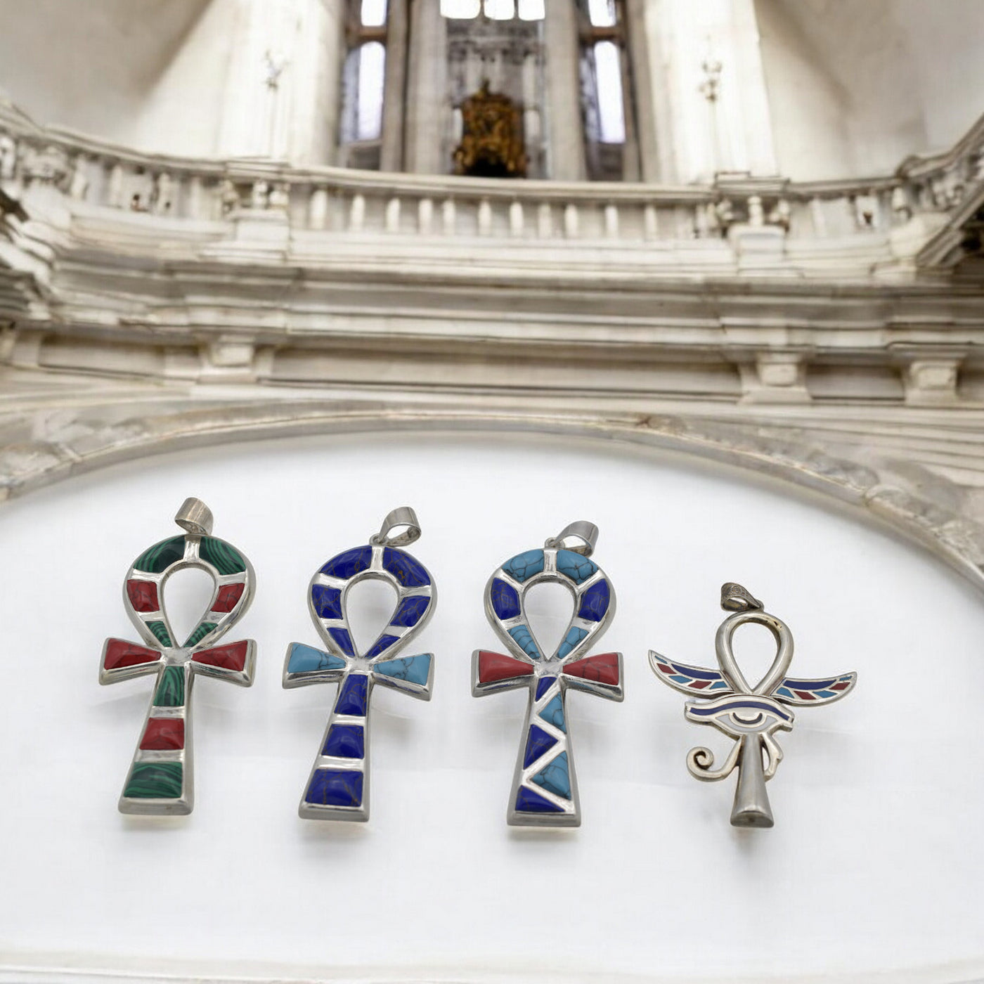 Colorful gemstone ankh pendants with ancient Egyptian design.