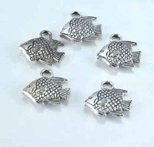 Five silver fish-shaped metal charms for jewelry making.