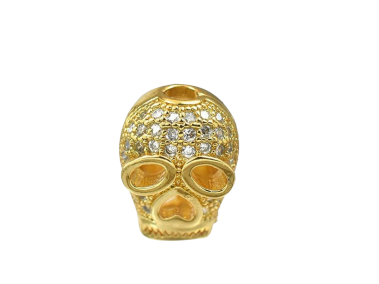 Gold skull charm with rhinestone detailing.