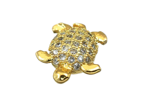 Gold turtle brooch with crystal embellishments.