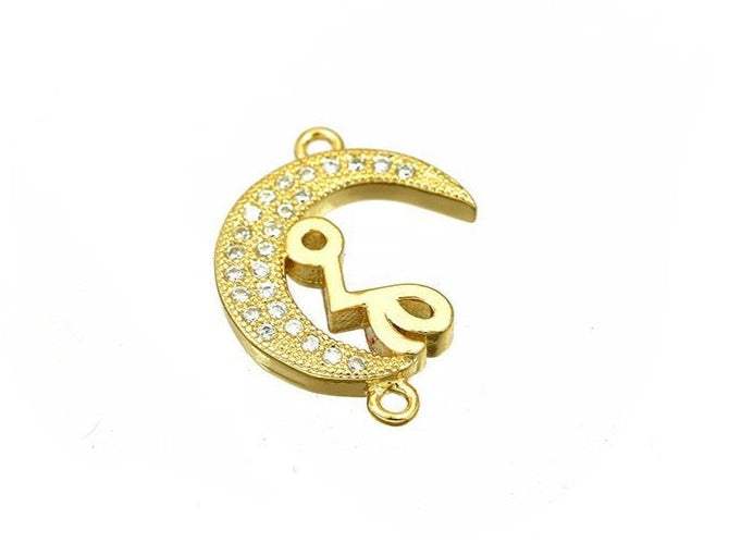 Gold crescent moon pendant with rhinestones and Arabic calligraphy.