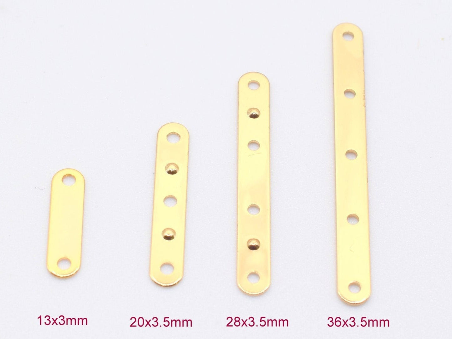 Four gold-colored metal flat bar connectors with pre-drilled holes, sizes 13x3mm, 20x3.5mm, 28x3.5mm, 36x3.5mm.