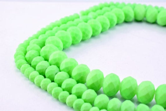 Faceted neon green acrylic bead strands.