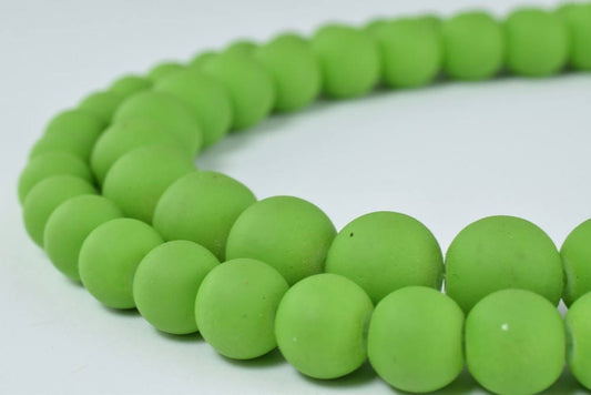 Green frosted glass bead necklace close-up.