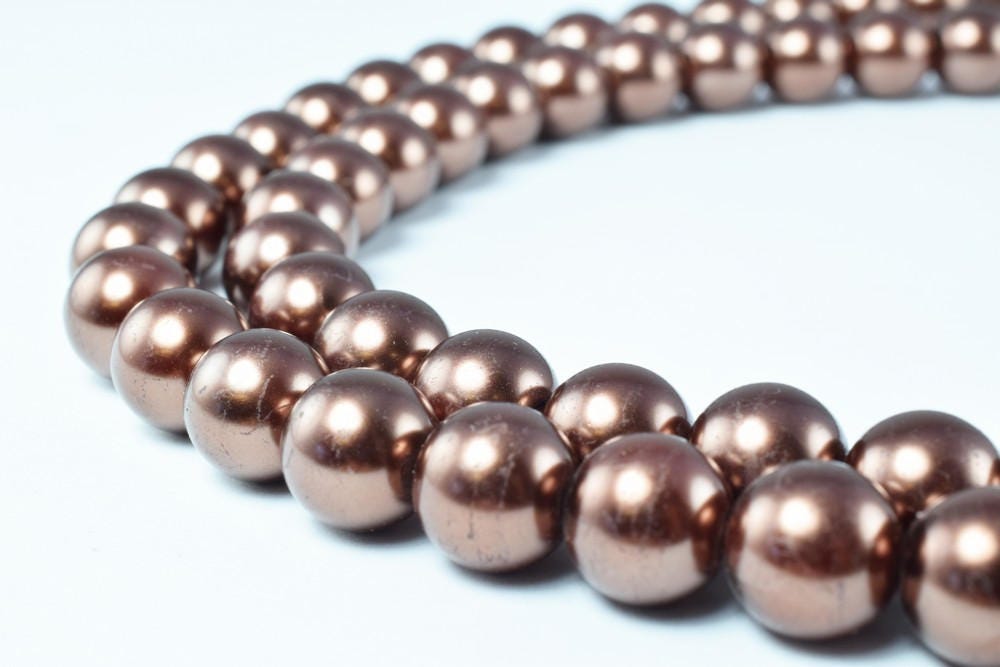 Copper metallic bead necklace close-up.