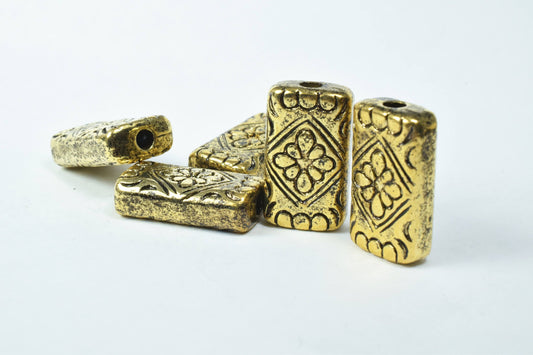 Antique gold rectangular floral beads for jewelry making.