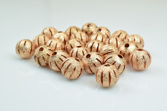 Gold textured round spacer beads for jewelry making.