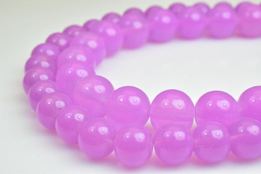 Purple bead bracelet on white background.