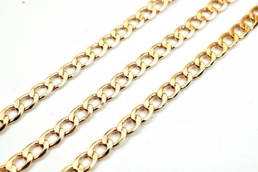 "Gold curb chain necklace links close-up"