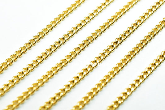 Gold plated rope chains on white background.