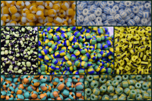 Multicolored glass seed beads in assorted patterns and designs.