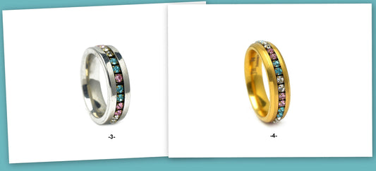 Silver and gold rings with multicolored gemstones.